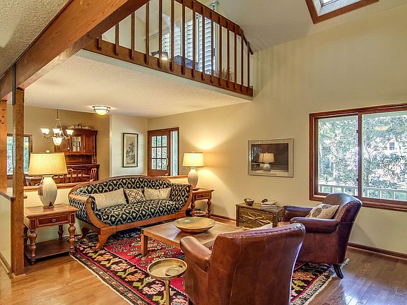 living rooms with loft above