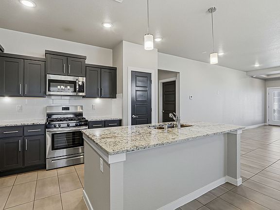 Modern Gourmet Kitchen with Stainless Steel appliances