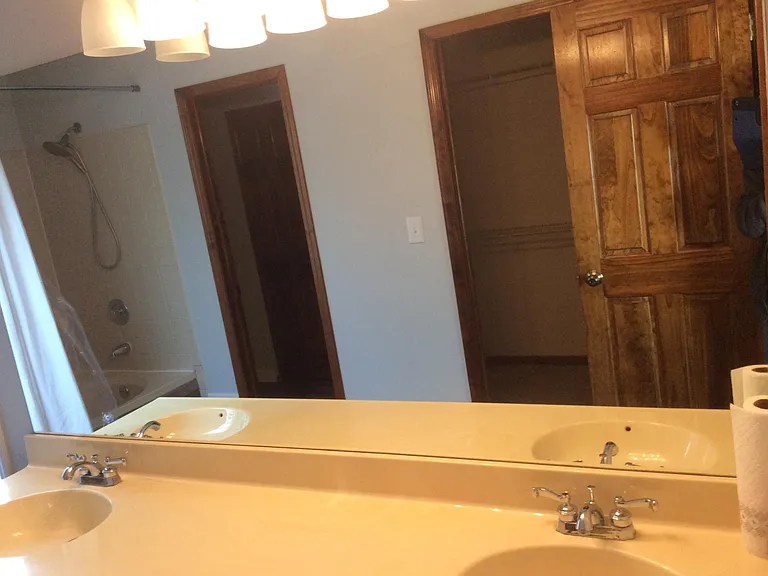 Main bedroom bathroom with walking closet and toilet with luxurious looking bath tub