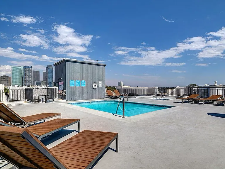 Rooftop heated pool/spa with 360 degree views of the city, lounge chairs and tanning beds.