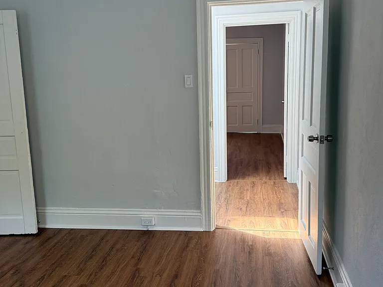 Front bedroom looking towards second bedroom and bathroom (note bathroom is captive to second bedroom, meaning you must go through that seconds bedroom to access the bathroom)