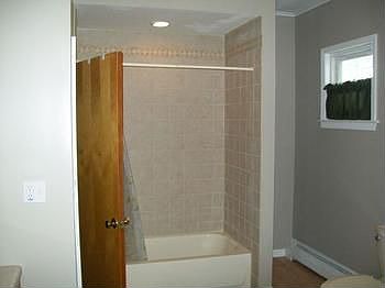 The shower that has been redone-very nicely done!