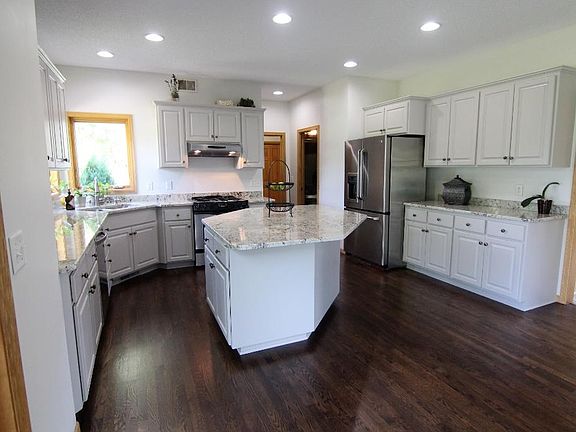 Gourmet kitchen features new granite counter tops, loads of cabinetry and stainless steel appliances...it's also plumbed for reverse osmosis or other water treatment at the sink.