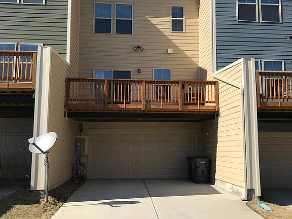 two car garage with large deck