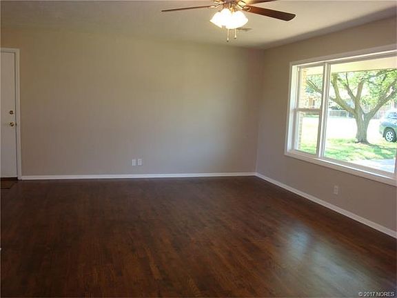 Another view of living room. Check out the beautiful refinished hardwood floors!