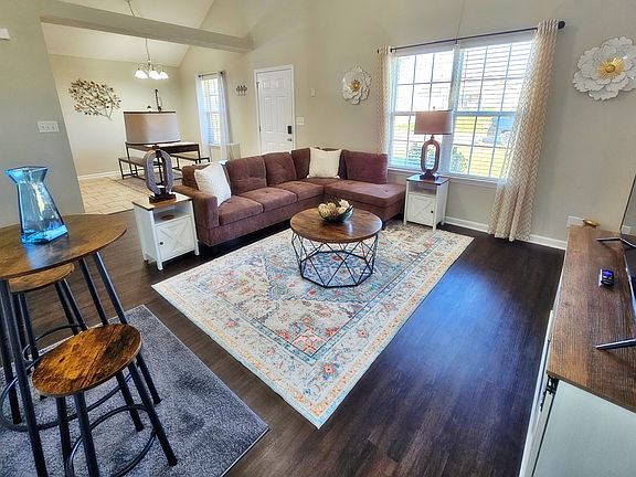 Kick back, relax in this comfy living room, and watch your favorite movie or show on the flat-screen smart TV.