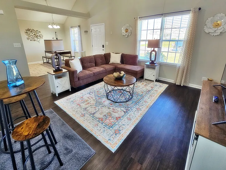 Kick back, relax in this comfy living room, and watch your favorite movie or show on the flat-screen smart TV.