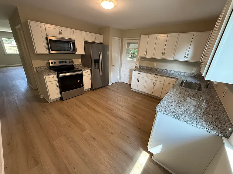 All new kitchen-- new cabinetry, granite countertops, luxury flooring, and stainless steel appliances!