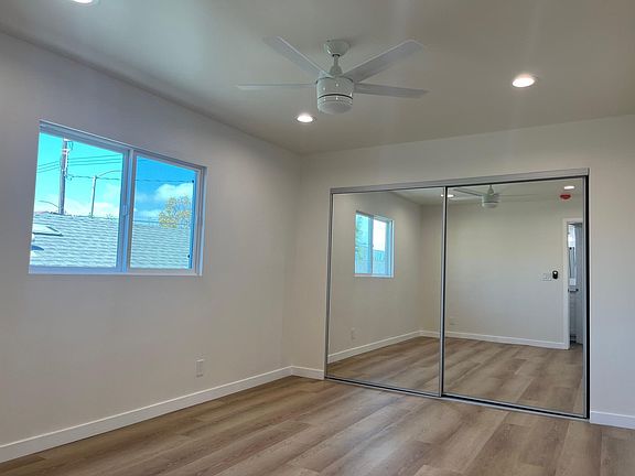 Bedroom with recessed lights and ceiling fan