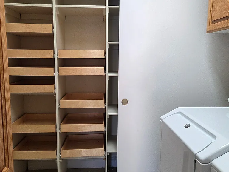 Laundry room off the kitchen with lots of storage