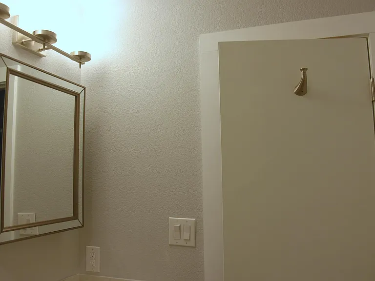 Robe or towel hook on door of upstairs bathroom