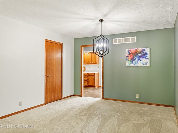 This is the formal dining room area with lots of space for your table and makes it able to be opened