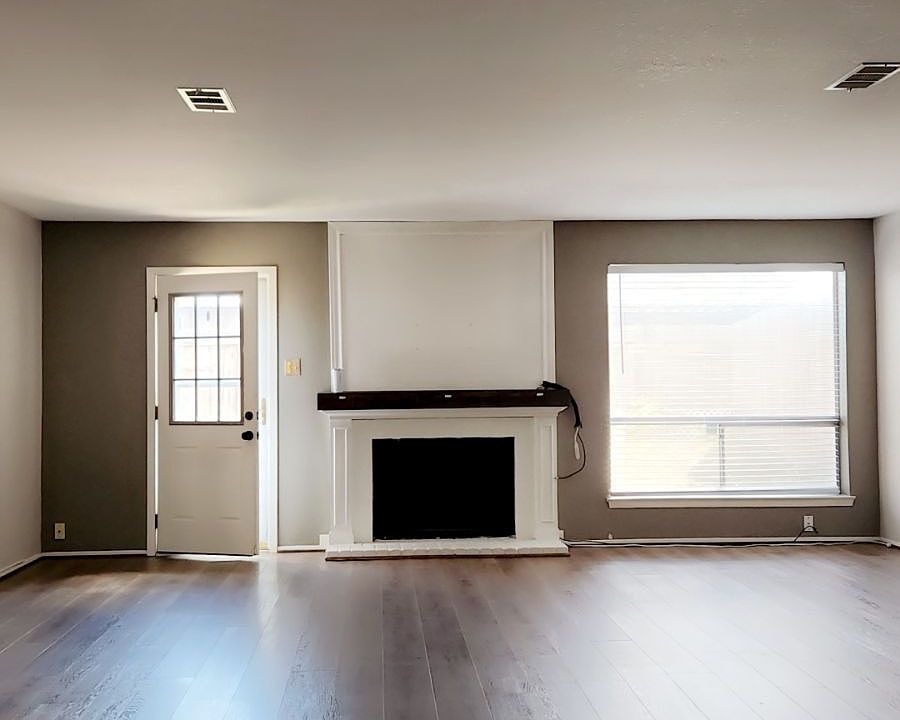 Living Room with a Wood fireplace, Back door to car port
