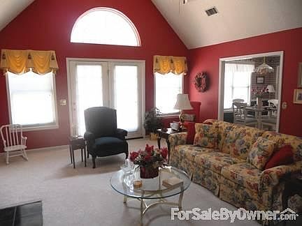 Living Room View From Foyer
						:
						Spacious with room for large sofa, love seat and other occasional chairs.