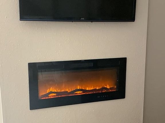 55 inch flat screen tv and fireplace included