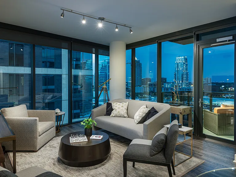 Open-concept floor plan with floor to ceiling windows