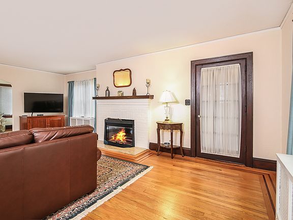 Living Room to Dining Room - beautiful leaded window at staircase to upper level