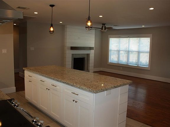 A view of the kitchen over looking the living room.