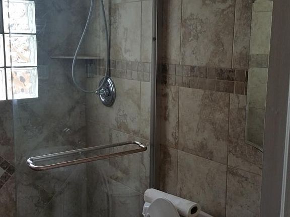 Upstairs bath/glass shower door