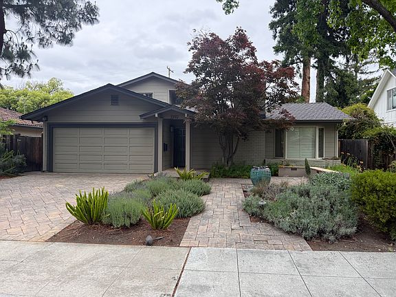 This charming home is an oasis situated on a quiet tree-lined street surrounded by manicured lush landscaping and majestic trees.