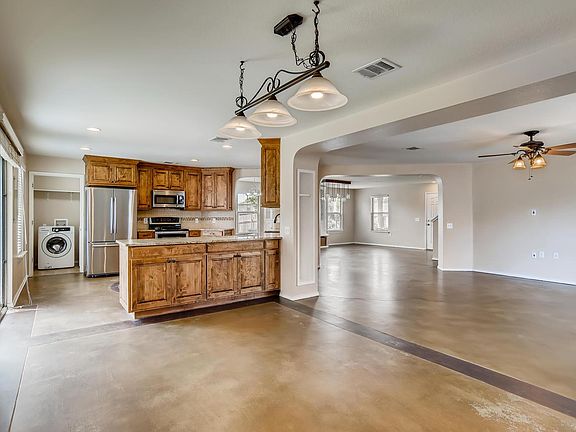 Second dining area looking into kitchen and living room