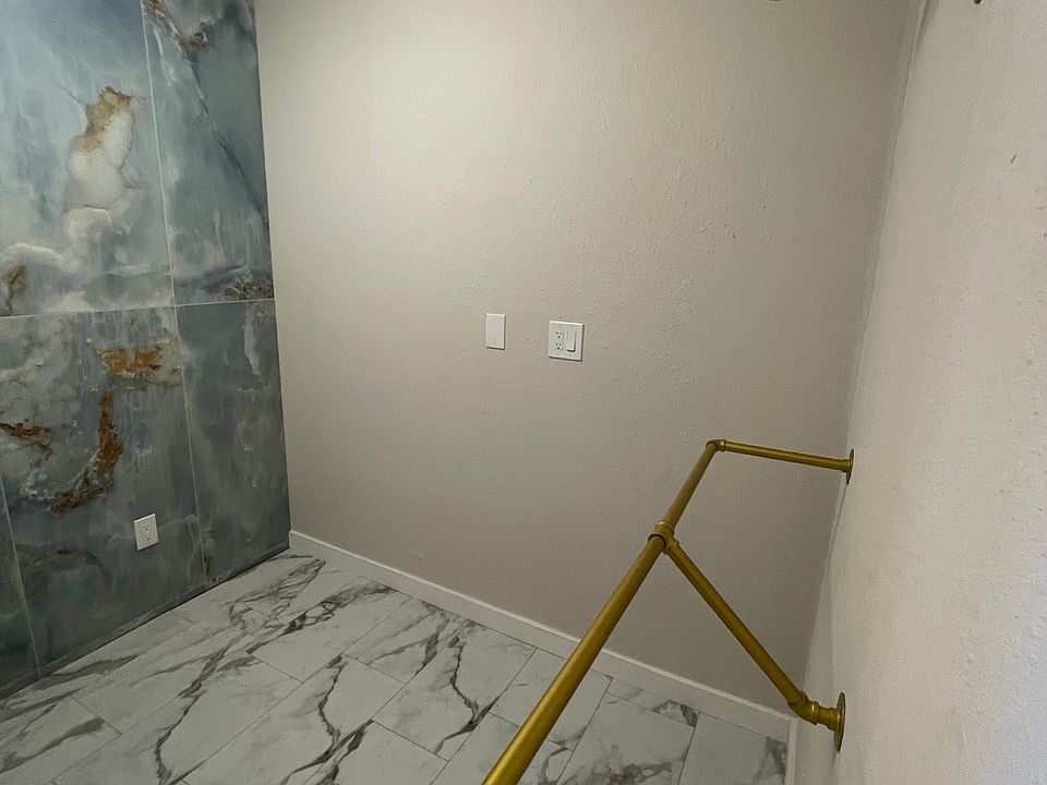 Closet space with room for dressers and vanity