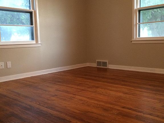 Bedroom. Both bedrooms and living room have hardwood floors.