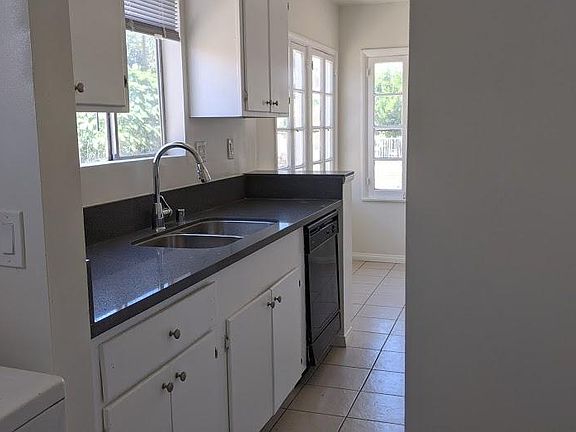 Quartz countertops in kitchen and main bathroom