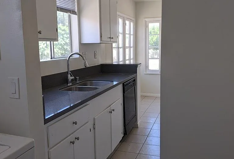 Quartz countertops in kitchen and main bathroom