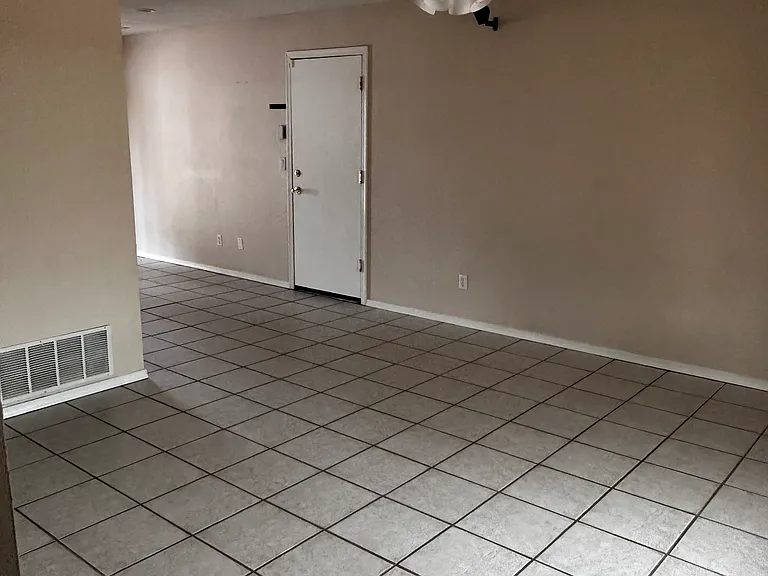 Living room area, walking in from front door