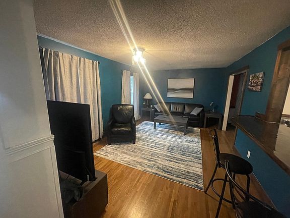 One of two living rooms. Referred to as the blue or game room.