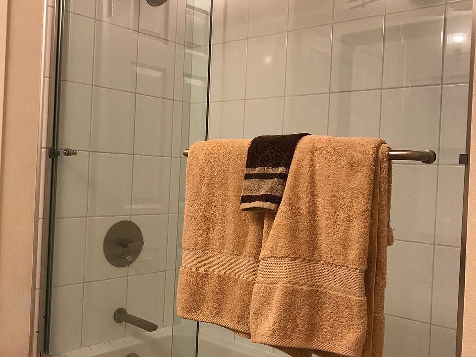 Guest bathroom with new tub and glass enclosures