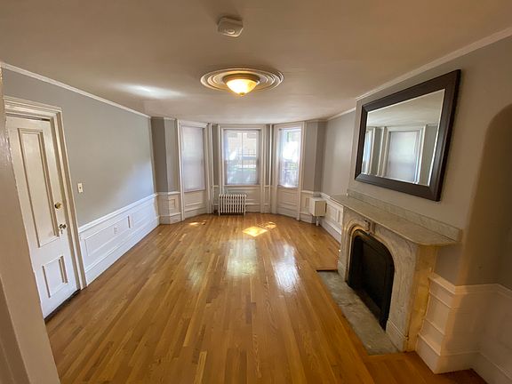 Front Room used as either Large Bedroom or Large Living room. Bay windows, marble fireplace.