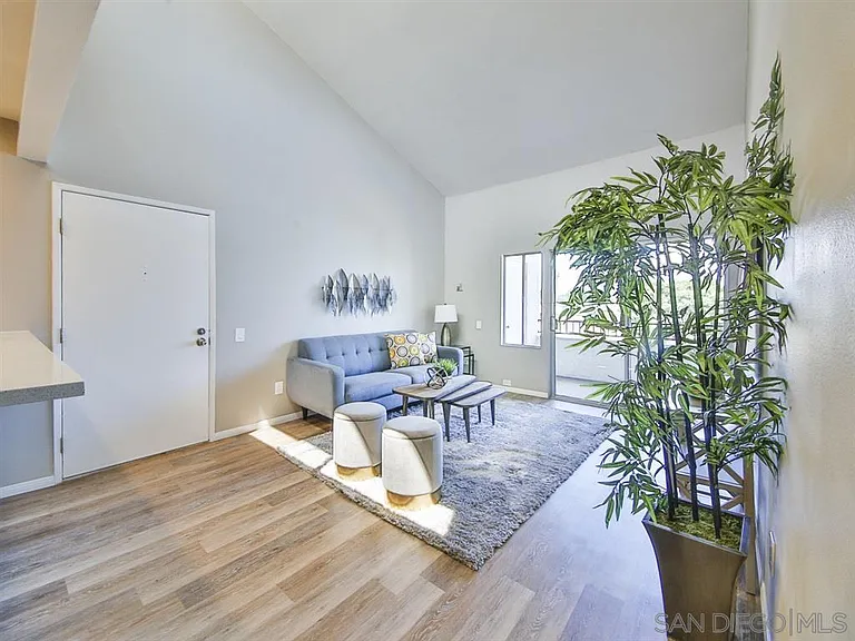 Older photo - lots of light in the unit and vaulted ceilings. The furniture pictured is different.