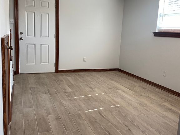 Front Room Newly Painted, New Windows and Window Blinds throughout home. New Ceramic Tile floors downstairs