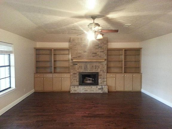 Living room built-ins and wood burning fireplace