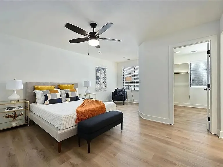 Large primary suite with luxury flooring, abundant natural light, and spacious modern layout.

Photos are representative and finishes or layouts may vary slightly by unit.