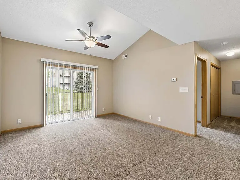 Vaulted ceilings and an airy layout give this inviting living space an open, comfortable feel that's perfect for both relaxing and entertaining.