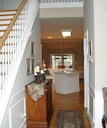 2 story Foyer to Hall, 1/2 bath on right