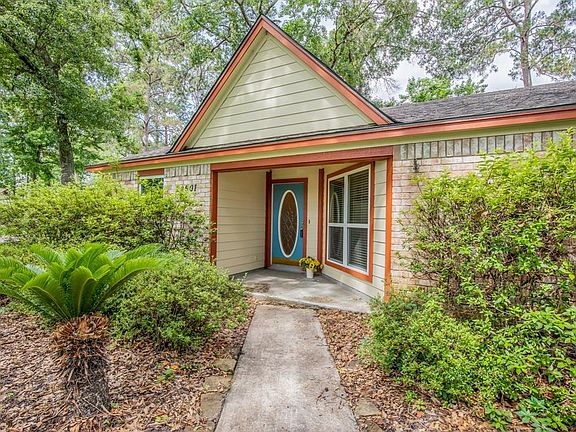 Adorable blue front door says "Come on in!" Due to rain, the lawn was not ready for pics... it now has new mulch, shrubs cut back and lawn mowed.