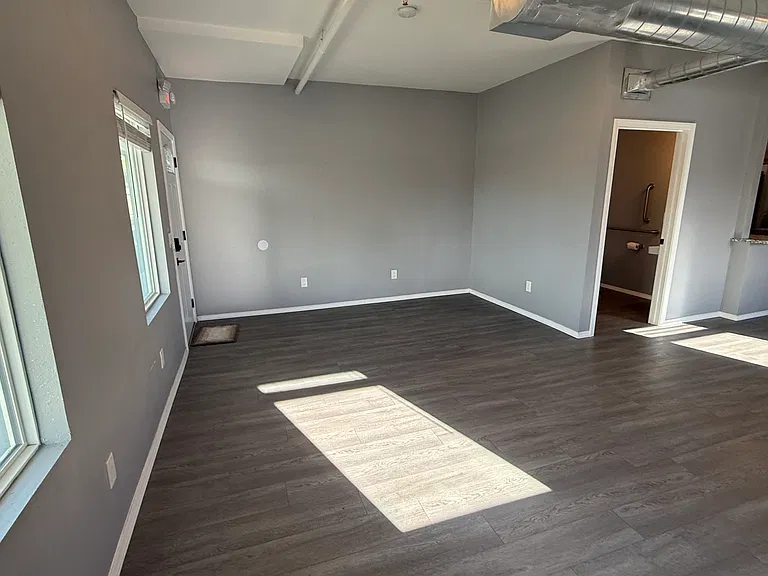 Living room, front bathroom and kitchen visible
