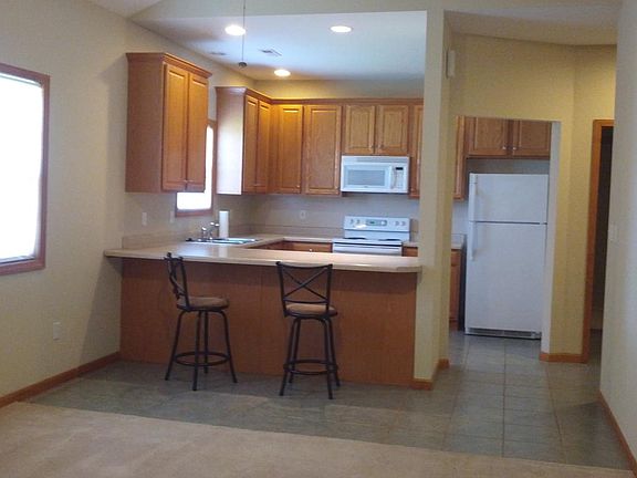 A breakfast bar overlooks the great room.