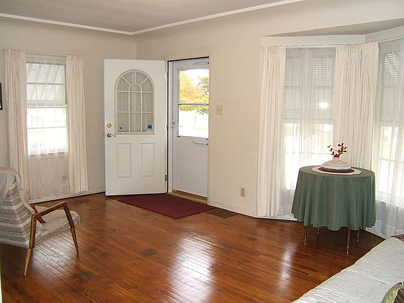 Living room with gleaming hardwood flooring