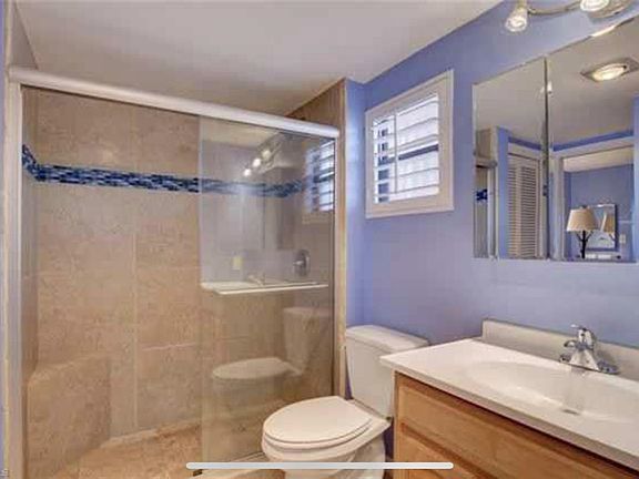 Updated tile shower with vanity