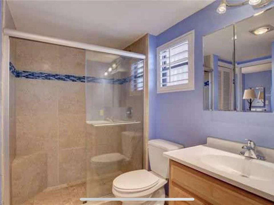 Updated tile shower with vanity