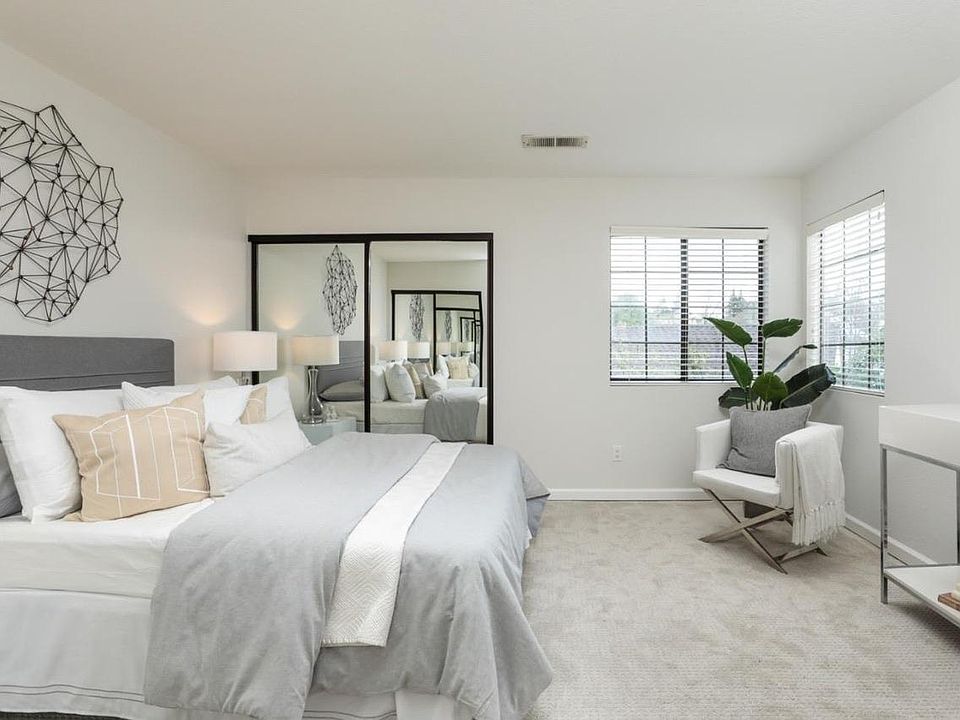 Master bedroom with two large sliding closets.