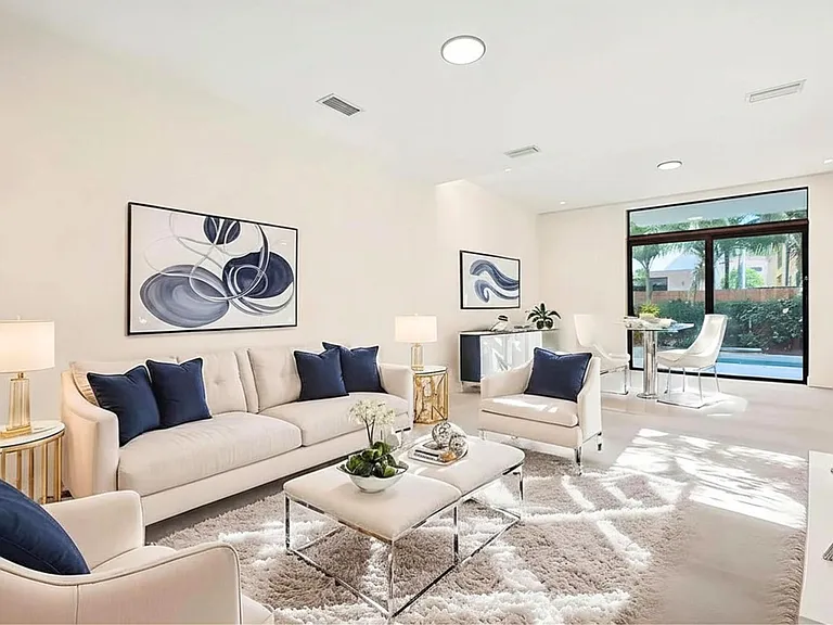 View of the living room overlooking your private pool and outside custom built in grill in case you feel like entertaining or just making a great culinary experience for yourself/family.