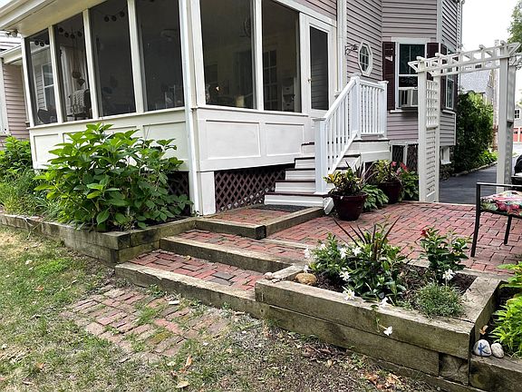 Private 3 season porch with patio and grill. Perfect for entertaining!