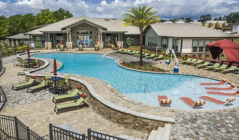 Looking across the resort-style swimming pool towards the resident clubhouse & leasing center