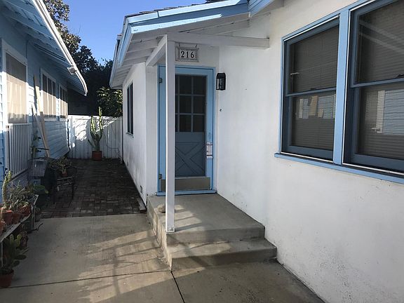 Front entrance, shared patio area to left